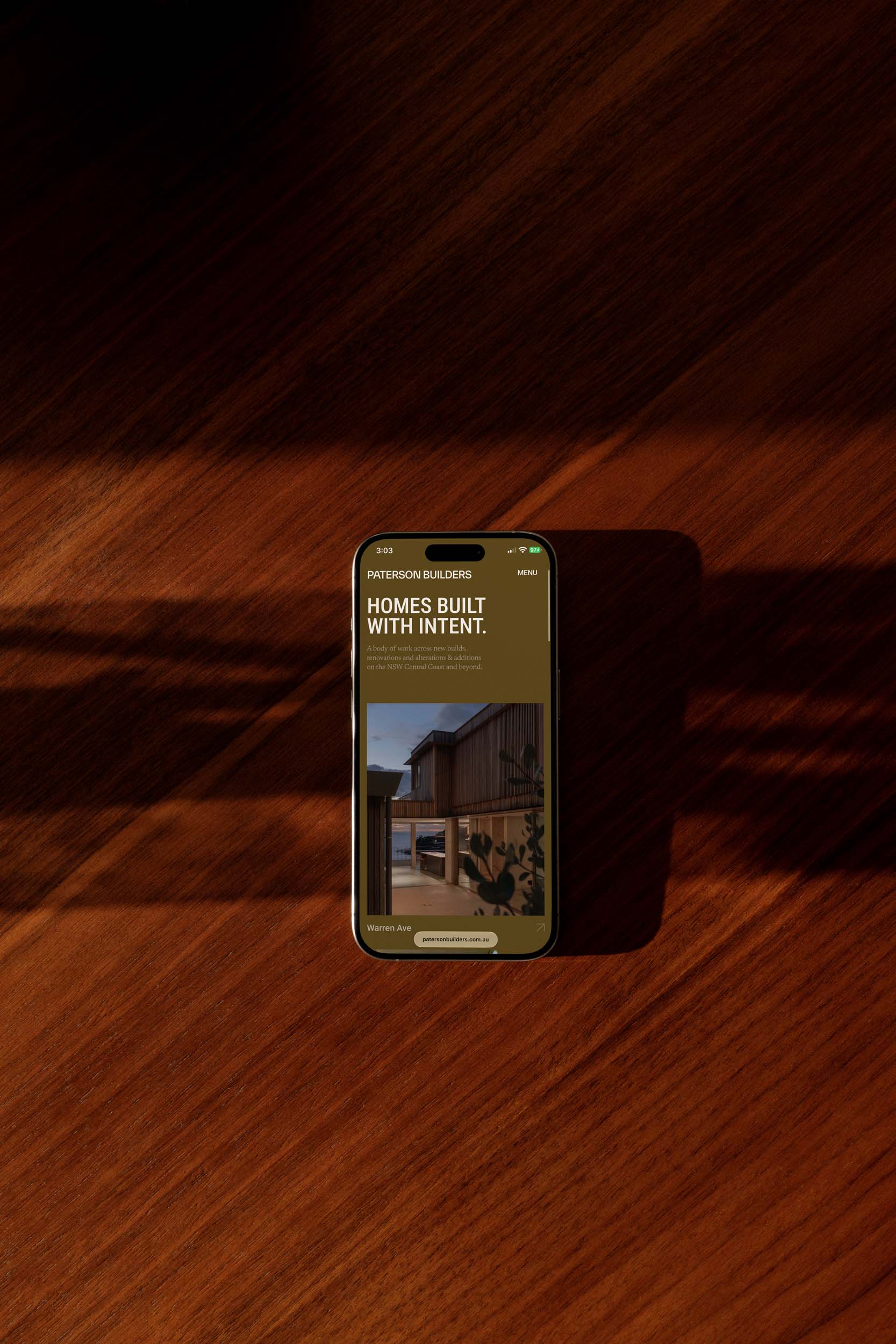 Paterson Builders website shown on a mobile phone